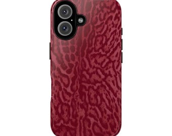 May include: A burgundy phone case with a leopard print design. The case has a dual-lens camera cutout and black side buttons. The overall design is a deep red with a textured pattern.