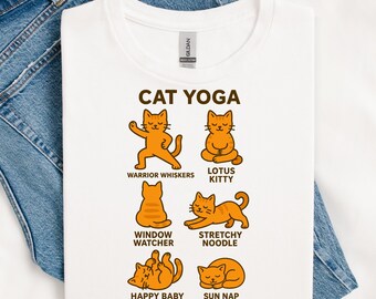 May include: White t-shirt with the text "CAT YOGA" and illustrations of orange cats in various yoga poses. Poses include Warrior Whiskers, Lotus Kitty, Window Watcher, Stretchy Noodle, Happy Baby, and Sun Nap.