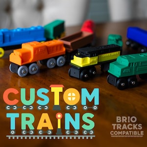 May include: A collection of colorful wooden toy trains in various colors, including blue, orange, green, and black. The image features the text "CUSTOM TRAINS" in vibrant colors, with the words "BRIO TRACKS COMPATIBLE" below.