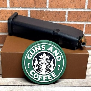 May include: A green and white patch with the text "Guns and Coffee" in a circle. The patch has a stylized image of a woman with a crown and a coffee cup.
