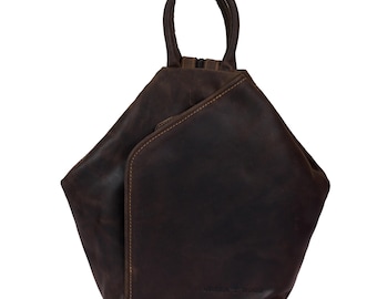 May include: A brown leather backpack with a unique triangular shape and a top handle. The bag has a zipper closure and a subtle distressed look.
