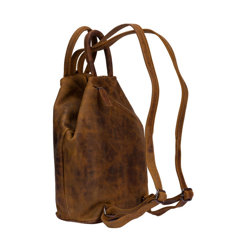 May include: A brown leather backpack with adjustable straps. The backpack has a drawstring closure and a distressed look.