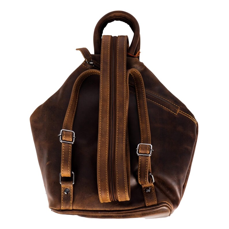 May include: A brown leather backpack with adjustable straps and a zip closure. The backpack has a distressed look and is made from high-quality leather.