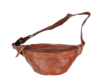 May include: A brown leather fanny pack with a zipper closure and adjustable strap.