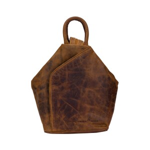 May include: A brown leather backpack with a triangular shape and a top handle. The backpack has a distressed look and the brand name "GREEN WOOD" is embossed on the bottom.