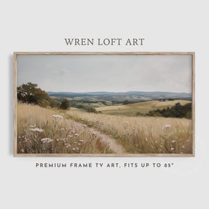 Peut inclure: Peinture de paysage encadrée représentant un champ d'herbes dorées et de fleurs sauvages, avec des collines en arrière-plan. L'œuvre est intitulée "WREN LOFT ART" et "PREMIUM FRAME TV ART, FITS UP TO 85".