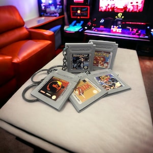 ビデオゲームカートリッジの形をしたキーホルダー GB ゲーム機 - ゲーマー - オタク - 男の子