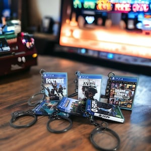 Porte clé en forme de boitier de jeux vidéo console PS4 - gamer - Geek