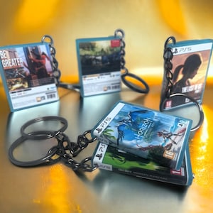 Porte clé en forme de boitier de jeux vidéo console PS5 - gamer - Geek