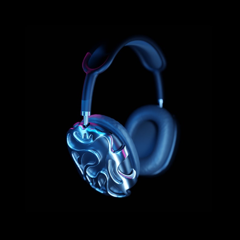 May include: A pair of black headphones with a silver, textured earcup. The headphones are illuminated with blue and pink light.