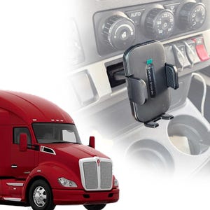 May include: A black phone mount with the text "Never Inside" on it. The mount is attached to the dashboard of a red semi-truck.