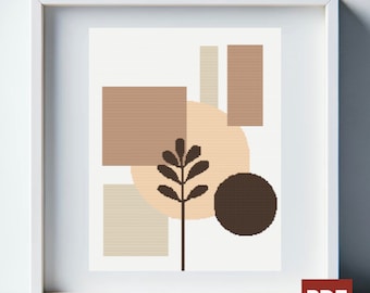 Op de afbeelding: Abstract geometrisch kruissteekpatroon met bruine, beige en crème vormen en een gestileerde bruine plant in het midden.