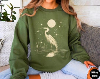 Sudadera con estampado de garza azul, diseño de aves en linograbado de arte popular.