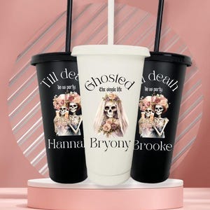 May include: Three reusable tumblers with lids and straws. Two are black, one is white. Each features a skeleton bride and groom graphic with floral accents. Text includes "Till death do us party," "Ghosted: The single life," and names.