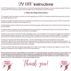 May include: A white sheet of paper with UV-DTF instructions. The text explains how to apply printed designs using UV ink and a transfer film. The instructions are in black text with a pink and glittery logo in the bottom corners. The words "Thank you!" are in pink script.
