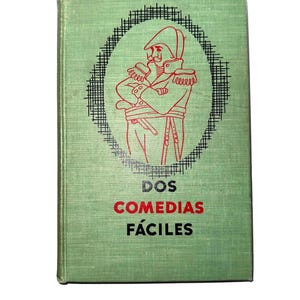 May include: A green book with a red illustration of a man in a military uniform. The title of the book is "DOS COMEDIAS FÁCILES".