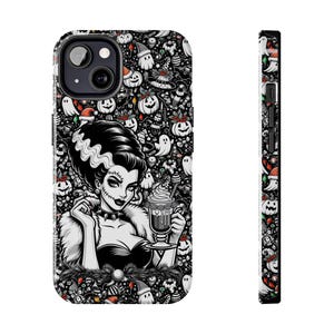 May include: Black and white phone case featuring a Bride of Frankenstein illustration holding a drink. The background is a pattern of Halloween-themed icons, including pumpkins, ghosts, and witch hats. The case is designed for a smartphone.