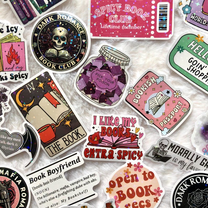 May include: A collection of colorful stickers with book-themed designs. Stickers include phrases like "Spicy Book Club," "Bookish Passport," and "I Like My Books Extra Spicy." Other stickers feature skulls, books, and a jar labeled "Pick Your Poison."