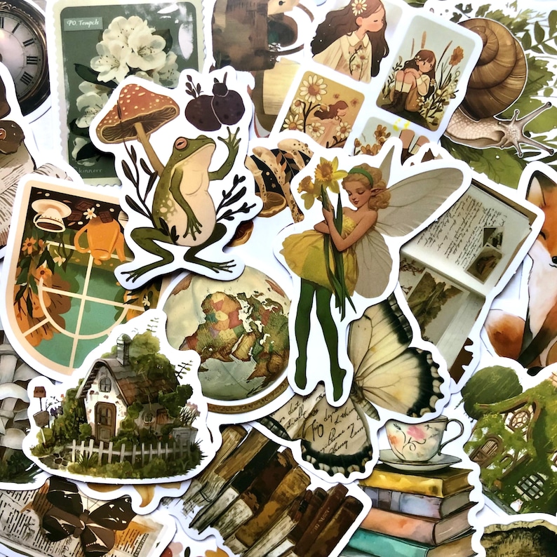 May include: A collection of vintage-style stickers featuring whimsical illustrations of a frog, a fairy, a mushroom, a butterfly, a snail, a house, and a globe. The stickers are printed on white paper with a matte finish.