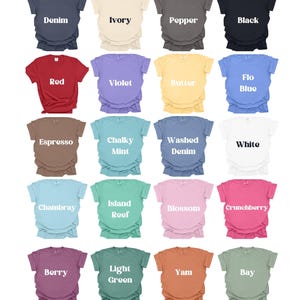 May include: A grid of twenty t-shirts in various colors, each with a different color name printed on it. Colors include denim, ivory, pepper, black, red, violet, butter, flo blue, espresso, chalky mint, washed denim, white, chambray, island reef, blossom, crunchberry, berry, light green, yam, and bay.