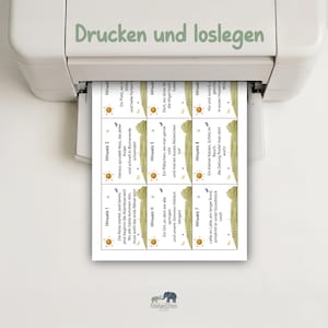 May include: A printer is shown with a sheet of paper with eight small cards printed on it. Each card has a sun graphic and German text. The text "Drucken und loslegen" is printed above the paper.