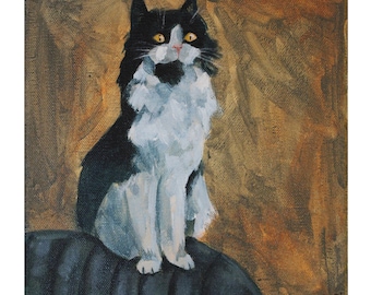 May include: A black and white cat with yellow eyes sits on a dark blue surface. The cat is looking directly at the viewer. The background is a warm brown color.