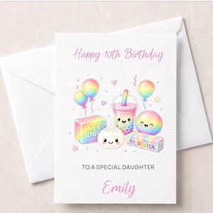 May include: A white greeting card with a pink Happy 10th Birthday heading, featuring rainbow-coloured illustrations of balloons, a boba tea, a dumpling, a ball, and boxes labelled Nee Doh and 4oz Salted Butter, with the text To A Special Daughter Emily.