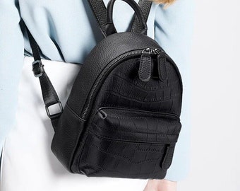 Women's mini backpack made of genuine leather. Minimalistic designer teen rucksack.