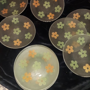 Sold individually  priced per plate.  Vintage Mcm Retro Frosted Glass Dinner Plates with flower design, flower power, 60s plates.  11 avail.