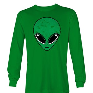 May include: Green long-sleeved t-shirt with a green alien face graphic.