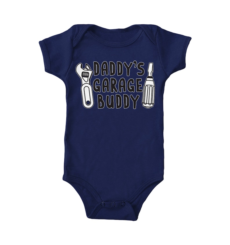 a baby bodysuit that says daddy's garage buddy