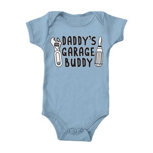 a baby bodysuit that says daddy's garage buddy