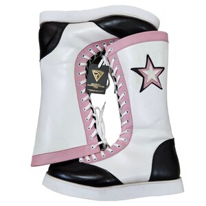 May include: White wrestling boots with black and pink accents. The boots have a star on the side and a label that says "Ricoff International Ltd."