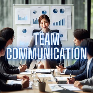 May include: A group of people sitting around a table, discussing team communication. The woman in the center is wearing a black blazer and has a serious expression on her face. The text "TEAM COMMUNICATION" is written in blue letters across the image.