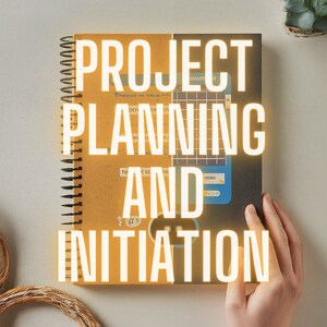 May include: A brown and black spiral bound notebook with the text "PROJECT PLANNING AND INITIATION" in yellow letters.
