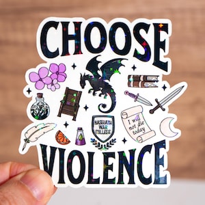 May include: A black and white sticker with the text "Choose Violence" in a glittery font. The sticker features a black dragon, a throne, a sword, a potion bottle, a feather, an orange, a scroll, a shield with the text "Basgiath War College", and a crescent moon.