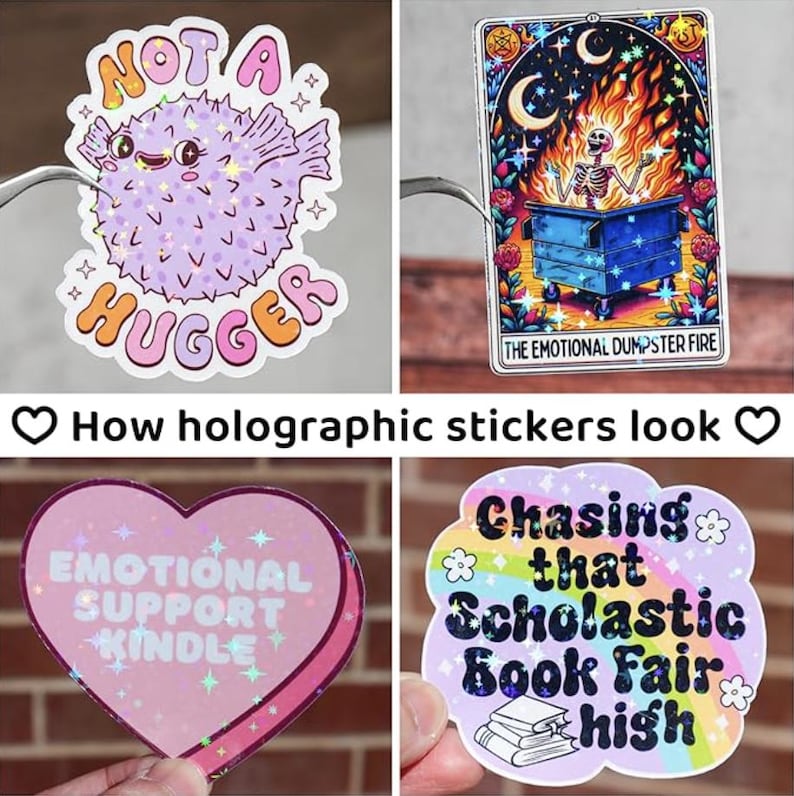 May include: Four holographic stickers with different designs. The first sticker is a purple and pink pufferfish with the text "Not a Hugger". The second sticker is a skeleton in a dumpster with flames and the text "The Emotional Dumpster Fire". The third sticker is a pink heart with the text "Emotional Support Kindle". The fourth sticker is a rainbow with the text "Chasing that Scholastic Book Fair High".
