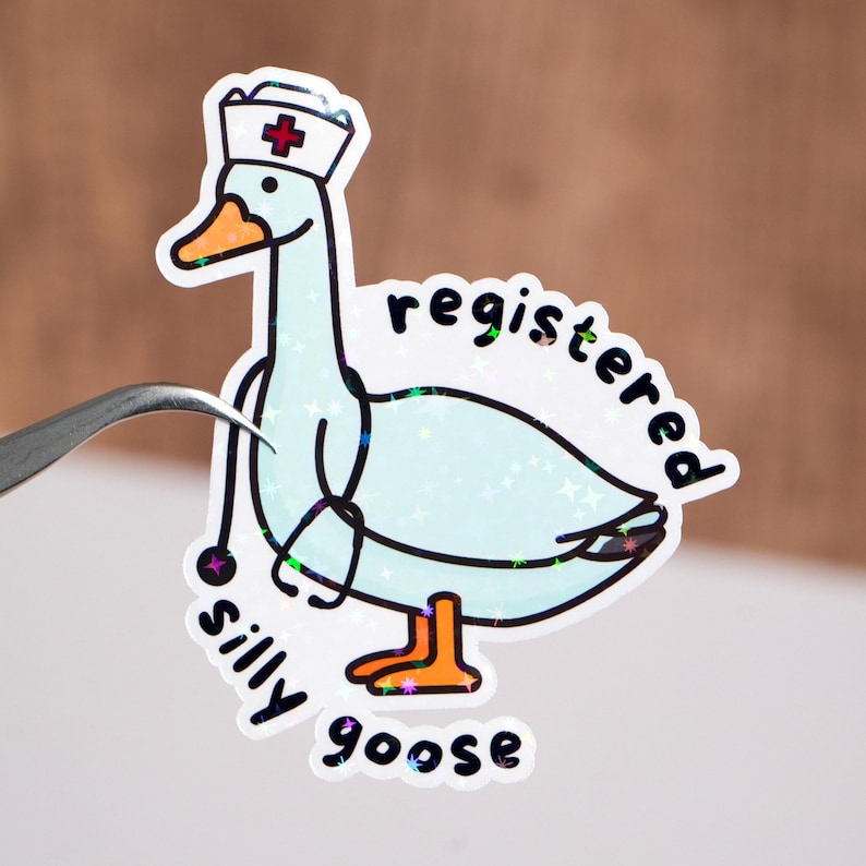 May include: A white sticker with a cartoon goose wearing a nurse's hat and holding a stethoscope. The text "registered silly goose" is written around the goose.