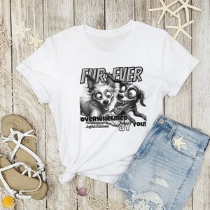 May include: White t-shirt with a black and white illustration of two dogs. The text "Fur-ever Overwhelmed by You!" is printed on the shirt.