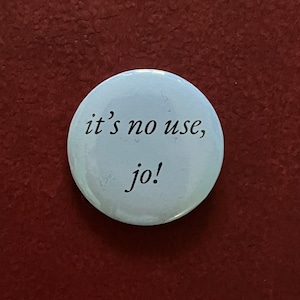 May include: A white button with black text that reads "it's no use, jo!"