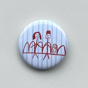 May include: A circular badge with a blue and white striped pattern. It displays a red drawing of a family holding hands, with a child in the middle. The family is depicted in front of a red mountain range.