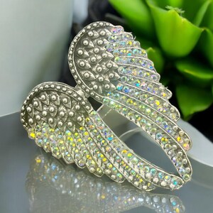 Angel Wing Statement Ring – Size 8 alloy ring with crystal rhinestones. Measures 3x4x2 cm, 13 oz. Trendy and lightweight, perfect for adding a touch of glam to any outfit. Ideal for fashion lovers and makes a great gift.
