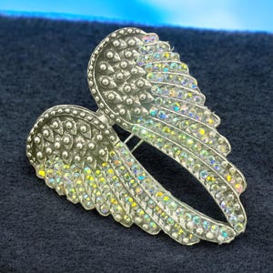 Stylish Angel Wing Ring, size 8 alloy with sparkling rhinestones. Compact at 3x4x2 cm, 13 oz. Ideal for everyday glam or as a unique gift for jewelry lovers.