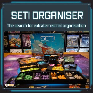 May include: A board game titled "SETI ORGANISER" with the tagline "The search for extraterrestrial organisation." The game features a box, game pieces, and a play mat with a galaxy design. The box art depicts a satellite dish.