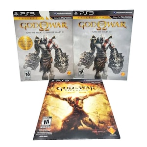 May include: Three PlayStation 3 game cases. Two are labelled "God of War Collection" and the third "God of War Ascension." The cases display action character art and the PlayStation 3 logo, suitable for gaming.