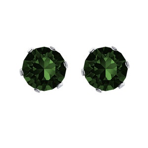 May include: A pair of silver stud earrings with round, dark green gemstones.