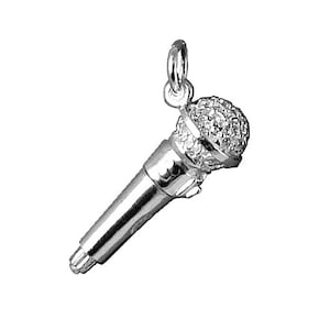 May include: Silver charm in the shape of a microphone with a textured surface.