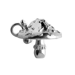May include: A silver charm shaped like a mushroom, with a textured top and a small stem. The charm has a loop for attaching to a bracelet or necklace.
