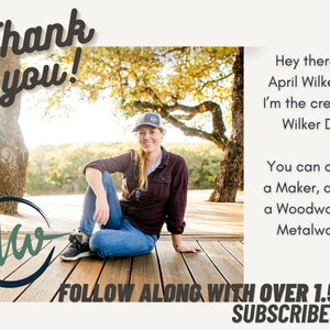 May include: A woman wearing a blue baseball cap sits on a wooden deck with a body of water in the background. The text "Thank you!" is in the top left corner of the image. The text "Aw" is in a circle with a green background and a blue outline. The text "FOLLOW ALONG WITH OVER 1.5M SUBSCRIBERS" is at the bottom of the image. The text "Hey there, I'm April Wilkerson... I'm the creator of Wilker Do's. You can call me a Maker, a DIYer, a Woodworker or Metalworker." is on the right side of the image.