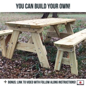 May include: A wooden picnic table with two benches. The table and benches are made of unfinished wood and have a rustic look. The table is set up in a grassy area with leaves on the ground. The text "YOU CAN BUILD YOUR OWN!" is at the top of the image. The text "+ BONUS: LINK TO VIDEO WITH FOLLOW ALONG INSTRUCTIONS!" is at the bottom of the image. There is a PDF icon with a download arrow in the bottom right corner of the image.